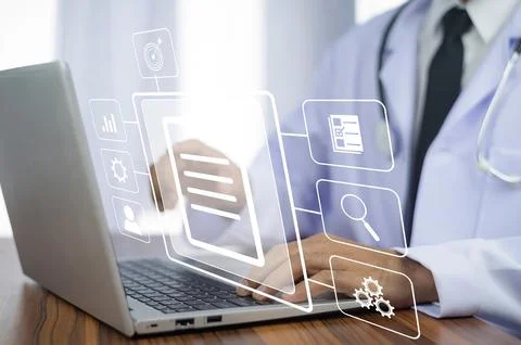 Doctor using computer Document Management System (DMS), online documentatio.. Stock Photos