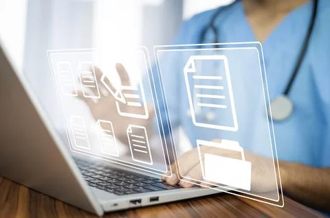 Doctor using computer Document Management System (DMS), online documentatio.. Stock Photos