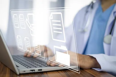 Doctor using computer Document Management System (DMS), online documentatio.. Stock Photos