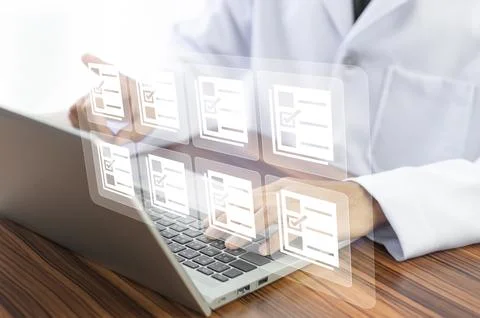Doctor using computer Document Management System (DMS), online documentatio.. Stock Photos