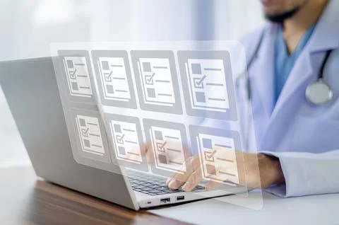 Doctor using computer Document Management System (DMS), online documentatio.. Stock Photos