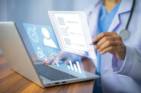 Doctor using computer Document Management System (DMS), online documentatio.. Stock Photos