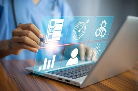 Doctor using computer Document Management System (DMS), online documentatio.. Stock Photos
