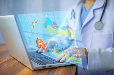 Doctor using computer loading document data and analysis for planning patient Stock Photos