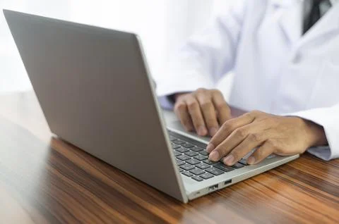 Doctor using computer working in hospital, Doctor using computer checking d.. Stock Photos