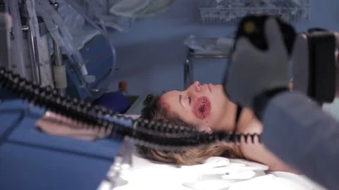 Doctor using a defibrillator on a patient Stock Footage 130688554