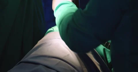 A doctor using defibrillator to pump at chest of unconscious with low heart rate Stock Footage 241981504