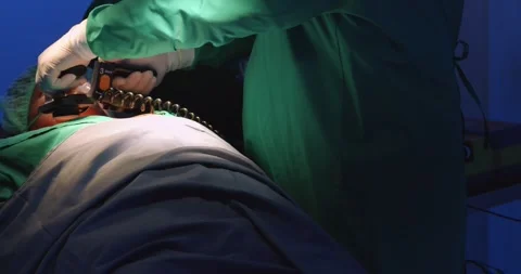 A doctor using defibrillator to pump at chest of unconscious with low heart rate Stock Footage 241981650