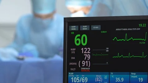 Doctor using defibrillator saving patient life, disappearing heart rate monitor Stock Footage 114348301
