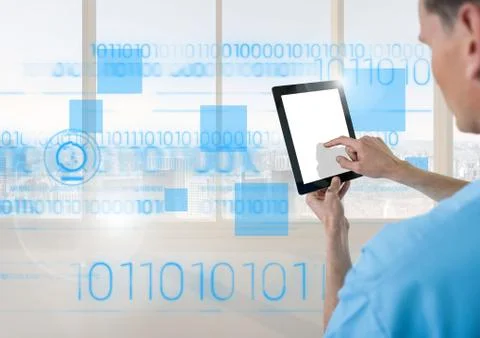 Doctor using digital tablet with blue interface in front of window 스톡 사진