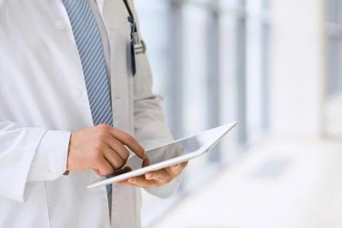 Doctor using a digital tablet, close-up of hands. Health care concept Stock-Fotos