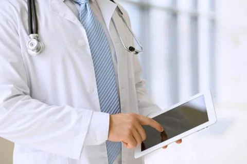 Doctor using a digital tablet, close-up of hands. Health care concept Foto stock