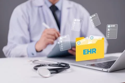 Doctor using digital tablet with EHR folder icon and medical records floati.. Stock Photos