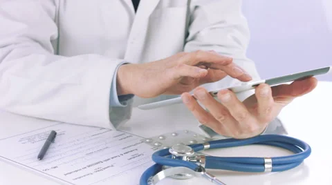 Doctor using a digital tablet Stock Footage 56457022