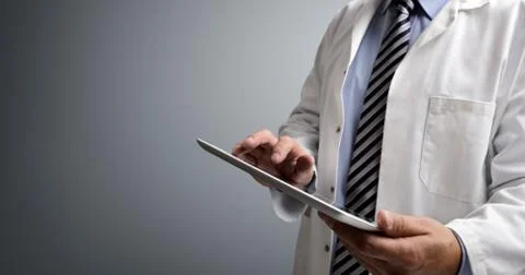 Doctor using digital tablet Stock Photos