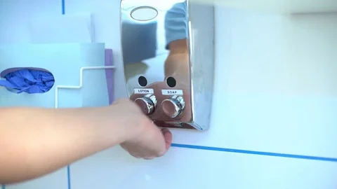 Doctor using feeder with hand sanitizer for disinfection Stock-Footage 73396343