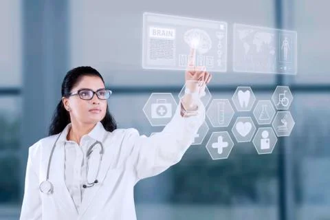Doctor using futuristic touchscreen interface Foto stock