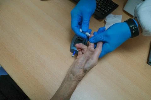 Doctor using a glucometer Foto stock