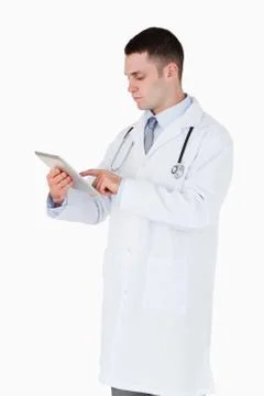 Doctor using his tablet computer 스톡 사진