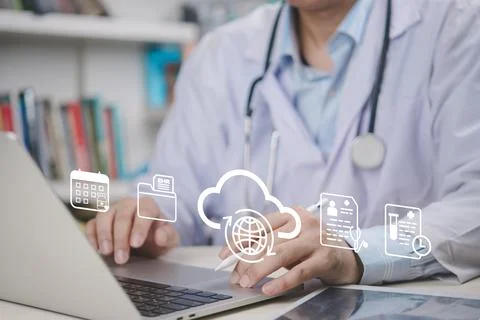 Doctor using laptop with cloud technology, electronic health records, and d.. 写真素材