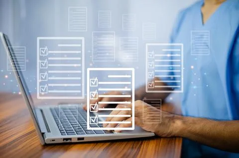 Doctor using laptop for digital document management in office, Foto stock