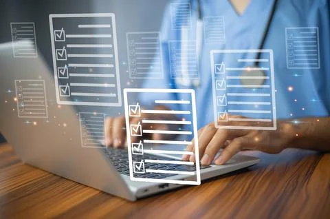 Doctor using laptop for digital document management in office, Stock Photos