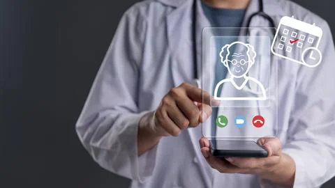 Doctor using smartphone video call consulting elderly patient virtual scree.. Stock Photos