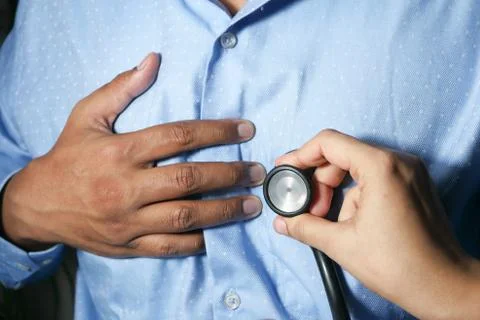 Doctor using a stethoscope checking body, close up Foto stock