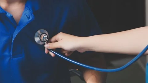 Doctor using a stethoscope checking patient with examining, presenting resu.. Stock Footage 344529469