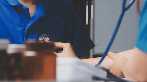 Doctor using a stethoscope checking patient with examining, presenting resu.. Stock Footage 344529536