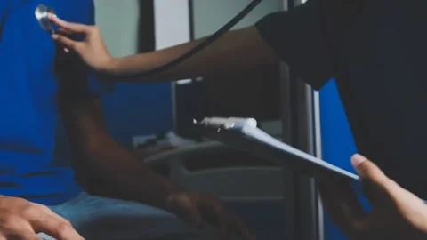 Doctor using a stethoscope checking patient with examining, presenting resu.. Stock Footage 344529587