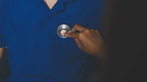 Doctor using a stethoscope checking patient with examining, presenting resu.. Stock Footage 344529595