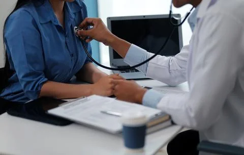 Doctor using a stethoscope checking patient with examining, presenting resu.. 스톡 사진