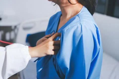 Doctor using a stethoscope checking patient with examining, presenting resu.. 스톡 사진