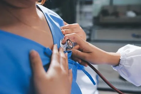 Doctor using a stethoscope checking patient with examining, presenting resu.. Stock Photos