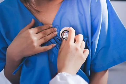 Doctor using a stethoscope checking patient with examining, presenting resu.. Stock Photos