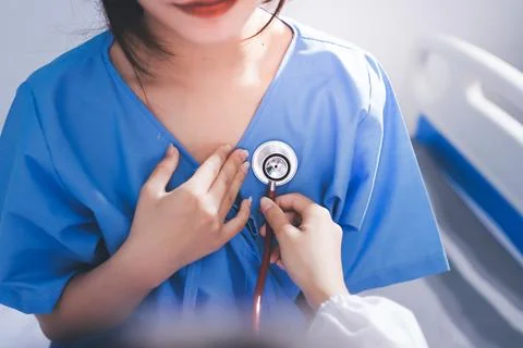 Doctor using a stethoscope checking patient with examining, presenting resu.. Stock Photos
