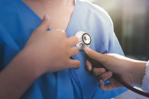 Doctor using a stethoscope checking patient with examining, presenting resu.. 写真素材