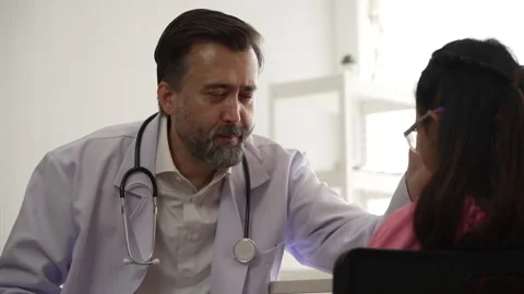 Doctor using stethoscope checkup and listen to heartbeat while talking to c.. Stock Footage 278356825