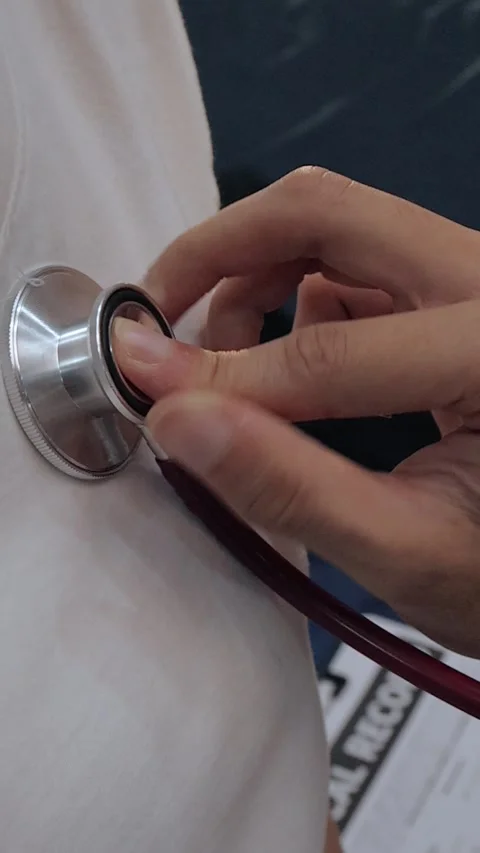Doctor using a stethoscope to examine a female patient's chest. Medical che.. Stock Footage 340539348