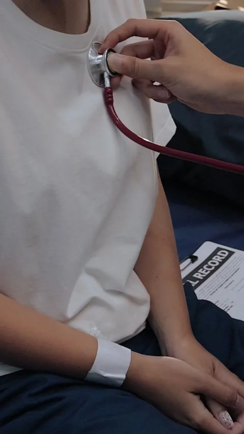 Doctor using a stethoscope to examine a female patient's chest. Medical che.. Stock Footage 340539361