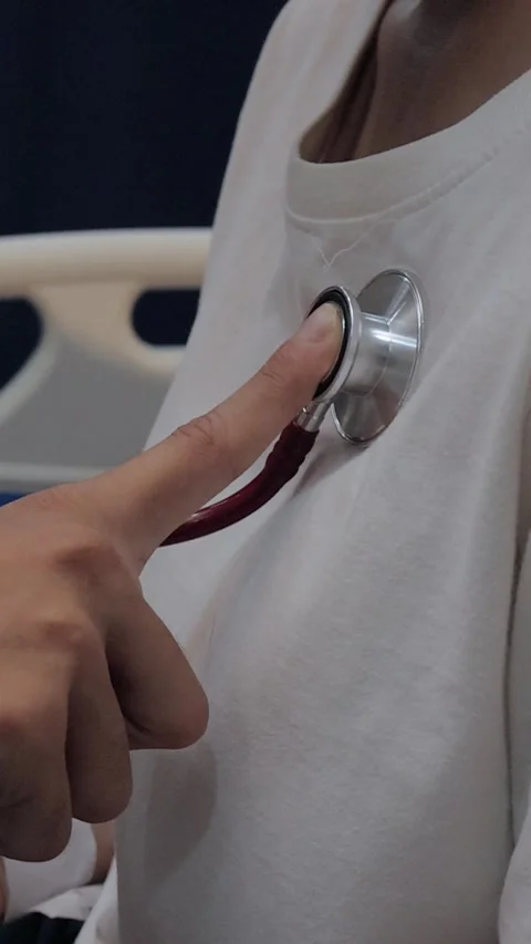 Doctor using a stethoscope to examine a female patient's chest. Medical che.. Stock Footage 340539366