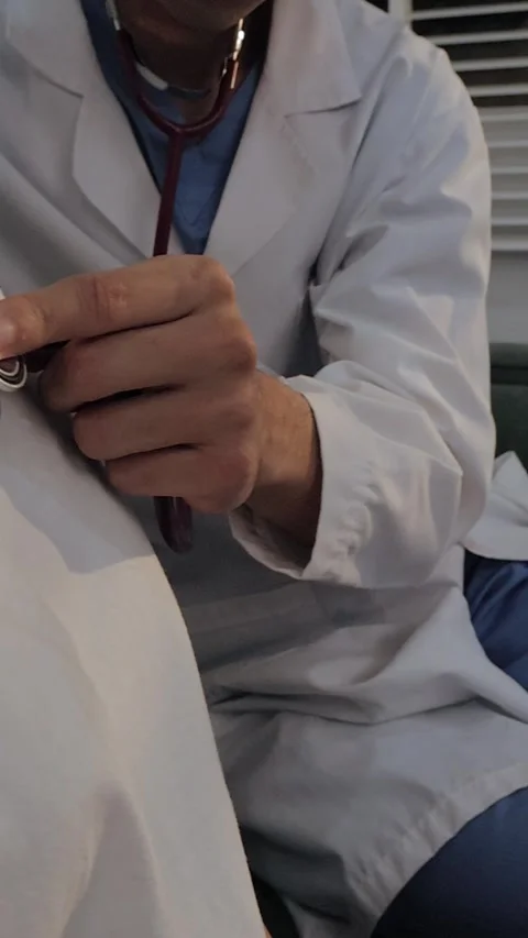 Doctor using a stethoscope to examine a female patient's chest. Medical che.. Stock Footage 340539413
