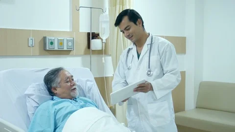Doctor using tablet and talking to patient. Stock Footage 95741666