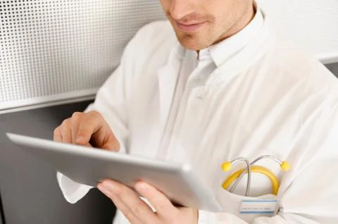Doctor using tablet computer Stock Photos