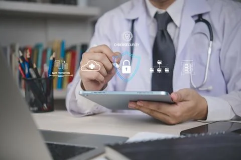 Doctor using tablet with cybersecurity icons, representing healthcare data .. Stock Photos