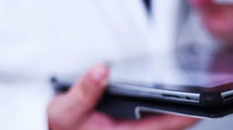 DOCTOR USING TABLET Stock Footage 28193402