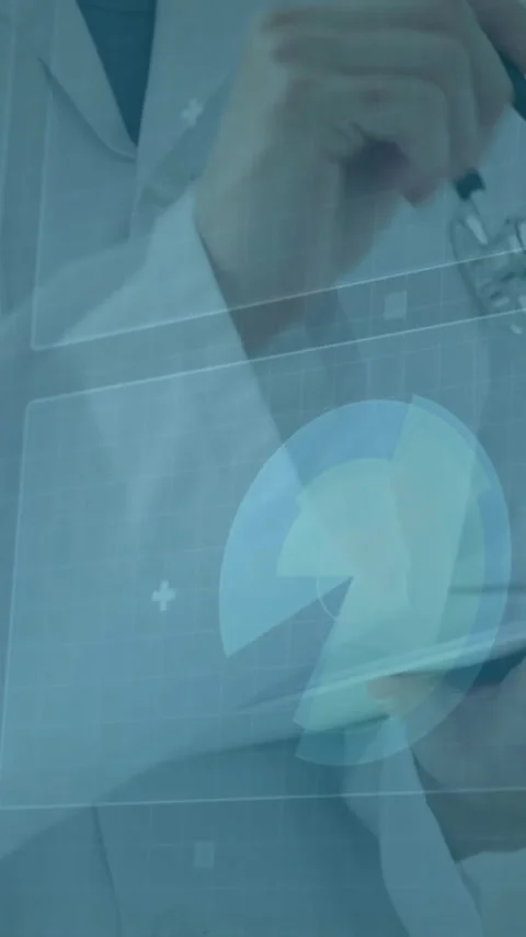 Doctor using tablet with medical data processing animation overlaid Stock Footage 343645503