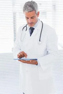 Doctor using tablet pc Foto stock