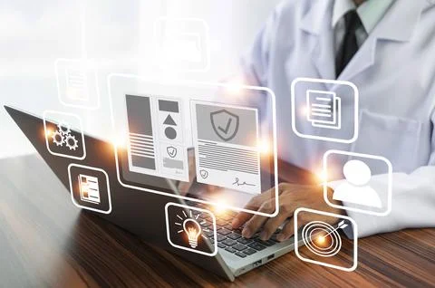 Doctor using technology document management on computer system management f.. Stock Photos